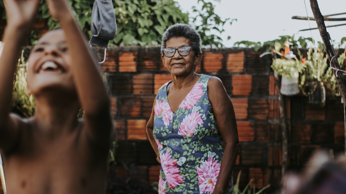 A heartwarming scene of a joyful boy and his grandmother enjoying time together.