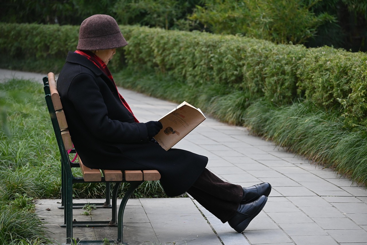 Senior woman with envelope and reading glasses in Modesto — illustrating this Medicare guide